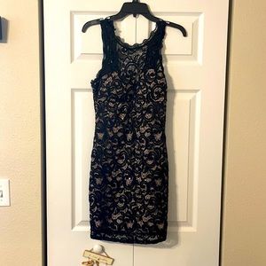Black lace dress, about mid thigh length